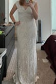 This dress was fine, I just wasn't crazy about it. I ordered a medium and it was true to size but not super flattering, I think it probably looks better on smaller people. Material was pretty good, I think it looked well made, just not for me. - Amy A.