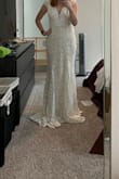 I chose to return this one because it was just ok. I wasn't a fan of the little cap sleeves and there wasn't really anything about this dress that I loved and for a wedding dress I wanted to absolutely love it. - Amy A.
