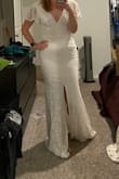 I should have ordered a medium and it might have been more flattering although the small fit. Really didn't like the sleeves and am not a big fan of the middle front slit. Thought the back was nice though. - Amy A.