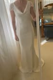 Figure hugging. Not see through. Beautiful lace. Stretchy material and very comfortable. Perfect length small train - Victoria G.