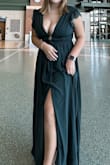 I LOVE this dress!! It's incredibly flattering and super comfortable. I'm 5'3 and it was still long on me when I was wearing heels so if you're shorter I would suggest getting it altered! It was a much deeper V than I was expecting and I have a pretty big chest so I used boob tape to keep everything in place but it still looked good without it. Other than that, I am so glad I got this dress! It's 100% worth every penny! - McKenna K.