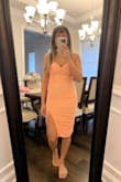 I love the way this fit on me. I am pretty short and I think the slit hits in the perfect place on me. If you are much taller than 5 ft you may find that it might hit too high. Overall, material is nice, stretchy, and adjustable straps. The ruching is flattering and helps disguise lumps and bumps! - Kavita P.