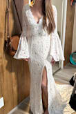 It was a perfect amount of lace! I am looking for a cottage/boho themed wedding with a big red barn and it fits so pretty for it! It's loose on the stomach just a tad but that's what I was hoping for - Ellie M.