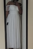 First off, this dress is as beautiful in person as it is on the website. The color is true and the pattern is adorable!
Unfortunately, it didn't look so great on me. First off, the chest fits like a shallow demi bra. Even with something on underneath, I was falling out of the top. When I pulled the dress over my chest, my boobs would sit underneath the cup.
Secondly, the sleeves are too short and too tight. I thought all reviewers wearing it off shoulder were doing so as a choice but I was literally constricted with the sleeves halfway up my shoulders. Even with the sleeves off the shoulder, my arm movements were limited.
The skirt is gorgeous and hit mid-shin on me.
I'm heartbroken because I daydreamed about this dress for a month before I bought it. I really wanted it to work but I would have to have the whole top portion redone. - Cali B.
