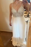 I love the dress! It's absolutely Gorgeous, but after putting it on I felt more prom queen the Bride! So sadly I'll be sending it back. Size 2 fit perfectly and wouldn't need any alterations except to hem bottom. - Lauren C.