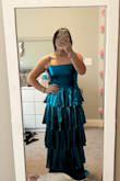 I'm pretty short but this dress is like perfect length, and I didnt even need to hem it. The color is a little darker than the picture but its honestly better. The material is super lightweight and good quality. The straps are adjustable too. It comes in the package pretty wrinkled but if you let it hang for a few days they come out. I wore this to prom and it was so fun! - Avery S.