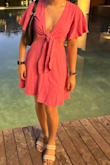 I wore this dress during our trip to Cancun! The pink color is beautiful and the fit is great! The material is super comfy and lightweight. I love this dress so much! I bought the midi version as well! - Fatimah