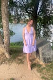 This was a perfect lightweight dress for the summer. It did not have adjustable straps but they were larger and did not slip. I did end up cutting off the bottom layer to make it shorter. - Alana L.