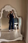 When I tried it on, I noticed that the middle area seems too bulky and not flattering at all! It looked like I had a bump on my stomach. The fabric is also too thick and not lightweight as it seems in the picture. - Andrea R.