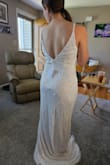 I said yes to the dress! The material is amazing and so soo comfortable! As soon as I put it on, I knew it was the one without looking in the mirror. It's elegant and will only need minor alterations (too long for my short self and the straps need a minor adjustment). I got this when they had a sale so I spent under $200 and don't mind paying for the alterations. - Andrea D.