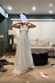 This dress is stunning! Pictures don't have great lighting but it's so sparkly and beautiful. I was so hesitant to buy on here and I don't regret it. I am still trying to figure out the straps and how they cross but it's so beautiful regardless. The item came in a box all folded up and I was so worried it would be wrinkled and it was perfect and had zero signs of being folded. Plus a free garment bag is a MAJOR plus! Will definitely be recommending and buying more items!! - Meghan S.