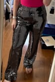 I bought these pants for a sparkle-themed night for a bachelorette party and they're perfect! I'm 5'1 so they're long on me but with heels, they'll be great. I went by the size chart and they're slightly big in the waist but not enough to be an issue. The only downside is that the little silver squares fall off and I leave a trail wherever I go. - Jennifer G.