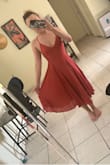 So like the other reviews, this dress is work to get into but once you figure it out, it will get easier. I had to iron it because it will come to you wrinkled, it's inevitable due to the fabric. The tie in the back works like a corset which snatches you up and makes the dress more flattering. - Sherera B.