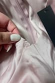 Bought this for my wife for a wedding. Received it today and straight out of the package some stitches were coming undone. She looks great in it but it's a shame it's coming undone. She's going to try to fix it because the wedding is tomorrow but she's bummed it came in like that. - Steven S.