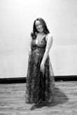 I loved this dress for a spring wedding! I got the length hemmed about 2 niches and wore a 2 inch heel and it fell perfectly. I didn't like how tight it felt around my ribs, it was difficult to wear in that sense. The zipper on the dress was also very difficult!! Otherwise, I loved it! - Stephanie S.