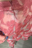 The top's tie is lower than I expected to be across my back, so that didn't fit me well (more of a personal fit problem than an issue with the outfit). The skirt fits well. However, the zipper stitching in the back of the skirt is not concealed at all. I understand there's a sheer layer on top, but for the price, this should absolutely be hidden; it looks cheap and you notice it from across the room. Also, there's black dye or something on it? I plan on returning this. - Carlyn V.