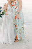 Beautiful dress, I got tons of compliments and felt so confident! The fit was flattering and color was pretty! I wore this to a destination wedding in Jamaica and the fabric was perfect. I wore 2 inch heels and it sat right before the base of my heels - Dorothy-Faye S.
