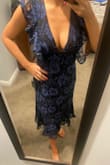 Beautiful dress. Definitely low cut but secure if you're willing to show the cleavage. - Ashley C.