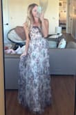 I got an xs in this dress and when came in it fit so well. I am a little bit short so I had to get about 3 inches hemmed off and I am wearing 3 inch heels but adjustments were easy to make. 
The ties in the back made it adjustable for my waist and made this dress fit perfectly.
I have a small bust, so I was afraid that that was going to be an issue but the cups don't overwhelm it there's only a little space. The material is a stiffer type of fabric, but it looks so good over the underskirt. It's a little bit darker than in some photos but that makes it even better for wedding, guests etc.. - Sierra W.