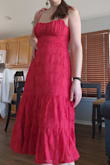The dress is cute and fits well. I didn't notice in the pictures of the model, but the back it elastic which in my mind makes it less formal than I originally thought, but it does make sizing more flexible. - Holly W.