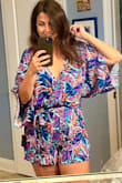 I loved this romper! The colors are as pictured and the material is soft and flowy. It fits true to size and is an absolute keeper. I went ahead and bought three other rompers in different colors from Lulus. An olive green, rose color, and a floral red print, and all are perfect. - Dalya E.