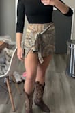 The bottoms are super cute! I usually order a medium bottom and this run a little large for me. I personally wouldn't size down though because it would be a lot shorter than I'd like. Can't wait to wear this to a concert! - Madelyn B.