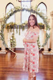 This dress is absolutely beautiful and soooo comfortable! 25 weeks pregnant in this pic, wore it to a wedding and received so many compliments. Cannot recommend this dress enough. - Elizabeth B.