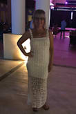 I bought this dress for our honeymoon and I love it, so did my husband! I have a curvy bottom so the large fit very well. Hugged perfectly. The mini slip dress on the inside is removable, so you could wear this as a crocheted swim cover as well. Loves the brightness of the white. Well made and highly recommend! - ML H.