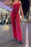 This fit exactly as I hoped it would! The color is amazing! A bit of a darker/rose pink than what's in the website pic, but I loved it even more. Super comfy! The fabric feels good and is fairly stretchy. I walked around in it all day, and could do all sorts of fun stuff and poses for pics:) For someone who has small boobs lol, I the side with no strap stayed up well (I used a sticky bra with it, too, which I think helped hold it up there haha). The pants are the perfect length for me, especially with heels! I added a belt to it because I wanted a good accent, but it looks good without one, too. Overall, SO good. Got so so many compliments and felt amazing. - Kelly K.