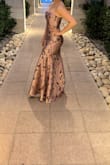 Dress is stunning. Has no stretch, fits true to size. - Reyna G.