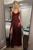 This dress ran slightly large - normally I'm between small and medium, leaning toward medium. Based on reviews I went for small and it was PERFECT! I am 5'9" and wore 3" heels - the dress was still almost to the floor (hitting the tops of my toes and occasionally getting caught on my heel). 
I wasn't sure how I'd feel about the draping fabric in the front, but I copied the model photos by tucking it in slightly and used double-sided fashion tape to adhere it to the top of my bra - no accidental flashing anyone and it stayed put all night! 
The slit is a little high to be considered modest, but isn't extreme by any means.
It was a pain and a half to steam the wrinkles out, but SO worth it! I got tons of compliments and felt like a rock star. - Emily M.