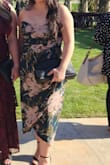 I love the way this dress looks on my body but not even a half-hour into the wedding I was attending as a guest, the boning ripped through the fabric! And this was before the ceremony even started. I had to pull out the boning and somehow the left-side stayed. The top of the dress did not fit and so it didn't stay on that well, I had to pull up the dress throughout the night and make sure my sticky bra wasn't showing. I'm not even sure if there is a way to make sure the bust of this dress stays upright. The fabric is really delicate and probably should not be used for a strapless dress. - Elain M.