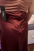 I really wanted to love this dress and was happy with it until I saw the back. The zipper pops out and does not stay flat so it kind of looked like I had a tail poking out. Otherwise, it fit great and looked stunning from the front but I couldn't find a solution for the tail. - Harmony T.