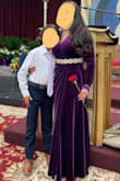 Very warm, comfortable dress.  I wore it for about 10 hours straight and it never bothered me.  I did have to get it tailored even with 3-inch heels but I am also miniature sized.  I also had it altered to put a button on the bosom because my girls were out, also to give the front a little body because it was a bit flat just as it was, also removed the exterior strings.  Bought a dress belt from Amazon and it came out perfect. - Jessica C.