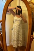This dress is so feminine with the lace cutout. I had to return the medium and order a large which fit so much better. Great dress for spring/summer outings. - Catherine S.