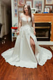 I absolutely love this dress! i actually bought a $800 wedding dress and still ordered this dress, and decided on this dress for my wedding in September. I sized up and it fit me perfectly! i am however going to get it altered more to show the slit more. - Desiree W.