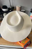The hat was exactly what I was looking for. Adjustable band, big brimmed pinch front hat. Thank you - Tonia M.