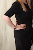 I wore this dress for an event and absolutely loved it. I wanted something a little more conservative, but with flare and that is 100% this dress. It was true to size and very flattering on me. I ended up buying it in blue as well as black. I know there is also a teal option, but that was sold out. Definitely worth buying this beautiful and flattering dress. - Nicole L.