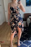 This dress has a very flattering fit and silky material. Short slip underneath is helpful too! - Kat N.