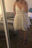 I had originally bought this for my engagement session but after trying it on there was more cleavage than expected. Not a deal breaker for me, I'll use it for a different occasion but if you have a bigger bust, it's definitely a little revealing! The fit is super comfortable and pretty true to size - the skirt does have a little volume to it but I don't think it's a lot - Angela P.