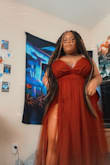 I live everything to the slits and how puffy it is with the material. I love it. - Laila C.