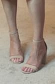 I bought these for the summer - when I feel like actually putting heels on but want something a little chunkier. Easy to walk in, adjustable straps, and the material is soft like suede. My only worry is the strap on the very back might rub as the night goes on - but that remains to be see. - Lara K.