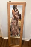 This dress is gorgeous! I bought it for an event, but didn't up end up going so I didn't get to wear it. I ordered an XL to make sure I had room for my bump as I am 26 weeks pregnant.  I could have easily sized down to the large. - Amanda C.