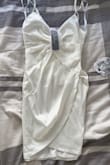 This dress is absolutely gorgeous!! It came in quicker than the shipping date as well. It is truly waist-hugging which I really love and not too short. Absolutely gorgeous, would so recommend! - Deanne S.