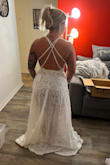 This dress is perfect and was everything I was looking for when it comes to my beach wedding dream dress. It's super classy, and not too extra. I'm a very down-to-earth easy-going bride and this dress met all my expectations. The pictures are not great but it still looks amazing and it's of me just trying the dress on! - Alexis T.