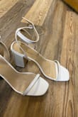 These shoes are gorgeous but the toe strap is VERY tight and the ankle straps only come with holes for thick ankles. I will be making a smaller hole in the strap to wear these.
Otherwise, the shoes are very cute and versatile. The snake skin texture helps them look a little more expensive and nicer than a plain white heel. - Caitlin S.