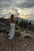 We had to postpone our bigger wedding plans due to damage to our venue and I didn't want to wear my wedding gown until the big day, so I ordered this dress and I have to say it worked out great! I did have to alter the side-boob area a bit to help everything lay better but overall loved the fit of this dress! It was short enough in the front not to need any altering with 3ish inch heels, but still left a small train in the back. - Gabriella H.