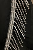 I kind of regret buying this as a final sale item. If you look at my pictures you will see that some of the rhinestones are sewn facing outwards and some inwards. It's cute and I bought it for Nashville, but I don't love how they are not all facing outwards to sparkle. - Vannyda K.