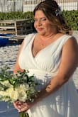 I love this dress. I bought it for my own beach wedding. I did have to take it in the bust, and the shoulders as it was a little too big on the top. From the waist down, it had a perfect flow. I did have to buy a 3X because they do run small. And I usually buy XL, so go 1 size up. The material is high quality. You will love it. I highly received it. I absolutely love my dress. - YENISEI P.