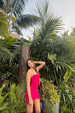 I bought this dress for my birthday and I absolutely loved it! The color in the photos looks red but it's actually a magenta pink in the sunlight! The only bad thing about it is that it sheds glitter like crazy. I thought it would be a different material but nonetheless, I wanted a sparkly dress and it delivered that. Just put a towel in ur car lol. - Isabella M.